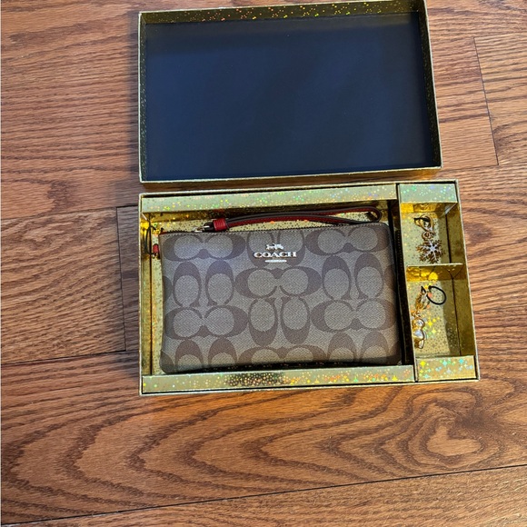 Coach Signature Brown Wristlet with Red Strap